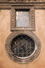 Bottom view of the wall of the Boim chapel in Lvov, Ukraine. Old Renaissance building with decorative porticos and round windows and niche for the icon.