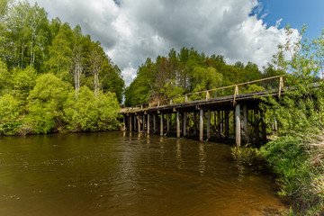Fototapeta premium wooden bridge over river