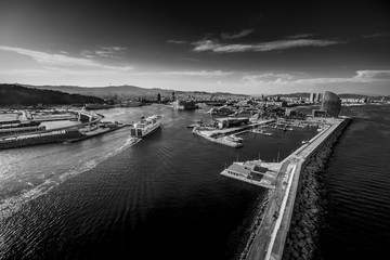 Aerial view of Barcelona cityscape from helicopter. Harbor. in black and white. fine art
