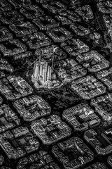 Aerial view of typical buildings of Barcelona cityscape from helicopter with Sagrada Familia. in black and white. fine art