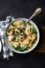 Italian wedding soup with meatballs and ptitim paste