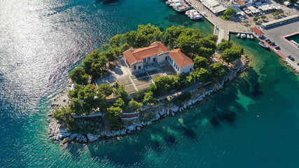 Aerial drone photo of amazing vegetated islet of Bourtzi built in small peninsula in port of Skiathos island main town hosting an old school, Sporades, Greece