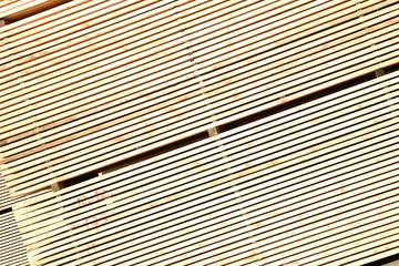 Fototapeta premium worked wooden boards stacked in a sawmill near Brunico. south tyrol, italy.