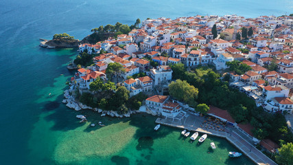 Aerial drone panoramic photo of picturesque main town of Skiathos island featuring small landmark peninsula of Bourtzi, Sporades, Greece