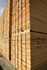 worked wooden boards stacked in a sawmill near Brunico. south tyrol, italy.