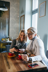woman drinking coffee in cafe