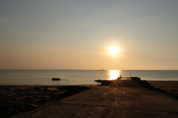 Concrete runway used to bring recreational or fishing boats down to the water with the car. Sunset time with clean sky at Fanny bay, Darwin, Norther Territory NT, Australia, Oceania