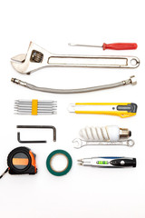 decorating and house renovation tools and other essentials on white background top view. flat lay composition