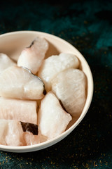 Fototapeta na wymiar pieces of frozen uncooked codfish