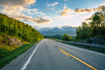 Fototapeta premium Mountain and road at sunset.