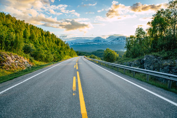 Ocean and road at sunset.