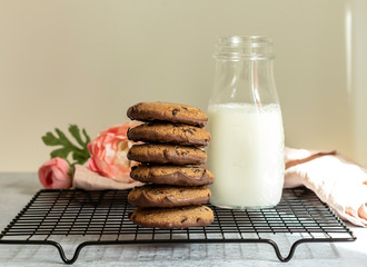 Oatmeal chocolate cookies with milk. Morning treats concept.