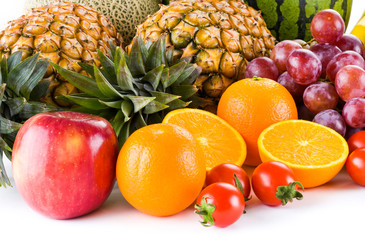 many kinds of fruits on a bright background, such as apples, bananas, pineapples, oranges, etc