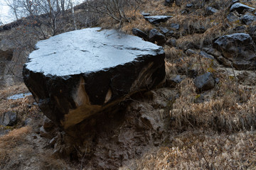 A centuries-old huge stone in the mountains