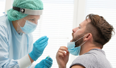 Doctor testing patient on possible coronavirus infection