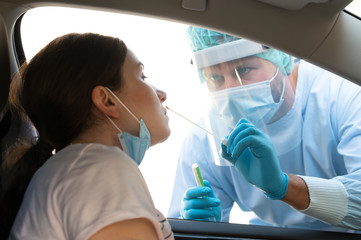 Woman getting tested at a coronavirus drive thru station