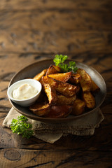 Roasted potato wedges with sauce