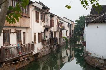 Fototapeta na wymiar Old town traditional houses and canal at Suzhou.