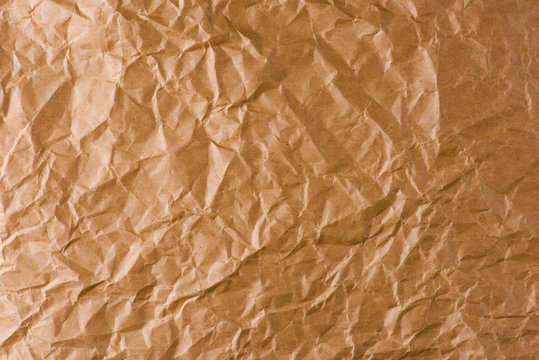 brown crumpled Kraft paper background. 