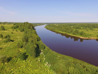 Bend of the Vychegda river against the blue sky, Komi Republic, Russia.