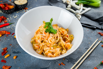Pasta fettuccine with shrimps on grey table