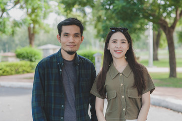 Asian man women couple love standing outdoor city park