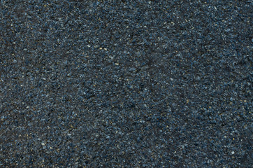 Black bituminous waterproofing. Gray Textured background. Top view