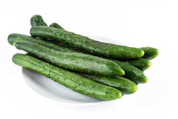 Close-up of fresh Gherkin on a white dish