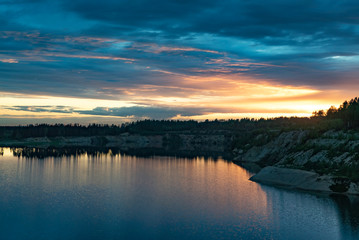 Sunset over a large lake in nature in summer.