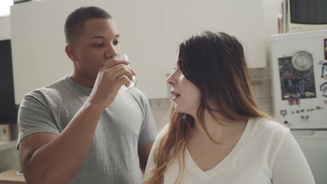 Interracial couple spending time at the kitchen