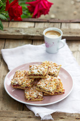 Streusel pie stuffed with rose jam, served with coffee. Rustic style.