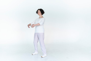 woman practicing qi qong at white studio traditional chinese gymnastics	