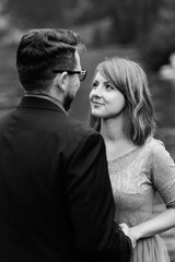 young couple on a walk near the lake surrounded by the mountains