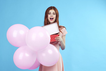 Obraz na płótnie Canvas Beautiful woman with pink balloons holiday fun birthday Gift happiness blue background