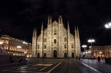 Obraz na płótnie Canvas Colorful, stunning front of the magnificent Duomo di Milano or Milan Cathedral during the night