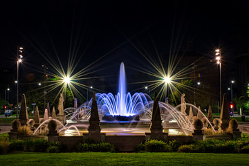 Colorful, stunning Fountain of The Four Seasons, Fontana delle Quattro Stagioni at Julius Caesar Square, Piazzale Giulio Cesare during the night. Long exposure photography