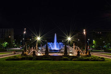 Colorful, stunning Fountain of The Four Seasons, Fontana delle Quattro Stagioni at Julius Caesar Square, Piazzale Giulio Cesare during the night. Long exposure photography