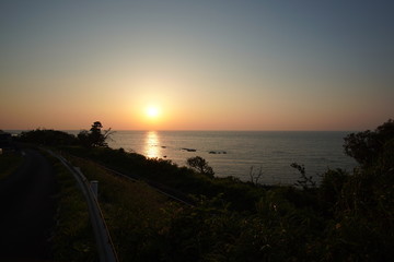 Beautiful bay view from the cliff over the setting sun 