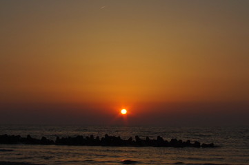 Fototapeta na wymiar Magic orange sunset over sea