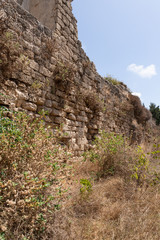 Fototapeta na wymiar Remains of old ruins of Kafarlet fortress. It was the property of Lords of Caesarea, then became the property of the Hospitallers. Captured by Baybars in 1291. Near the Atlit city in northern Israel