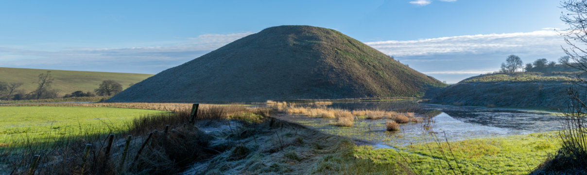 Silbury hill in Wiltshire England. Wintery image with frost on the ground.