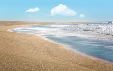 Endless, deserted golden sand beach at the Pacific Ocean, California