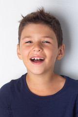 portrait of a boy with a happy smile.