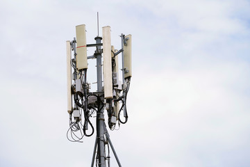 Telecommunication pole of 4G and 5G cellular. Base Station or Base Transceiver Station. 5G radio network telecommunication equipment with radio modules and smart antennas mounted on a metal.  