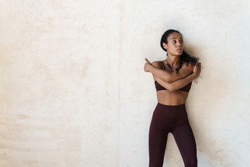 Photo of african american woman doing exercise while working out