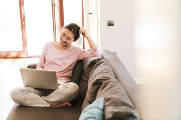 Fototapeta premium Attractive young asian woman using laptop computer