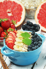 Healthy diet breakfast including cereal with berry and fruits	