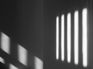 shadow on white wall with light from the window in the room