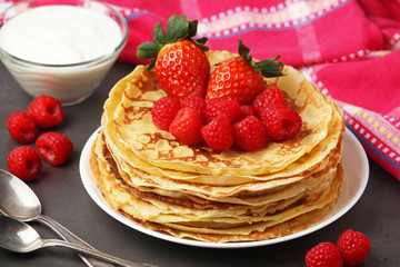 Russian cuisine national dish bliny with fresh berries	
