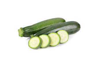 uncooked whole and sliced fresh zucchini on white background